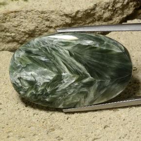 Serafinita verde natural 32,78ct, corte oval, opaco
