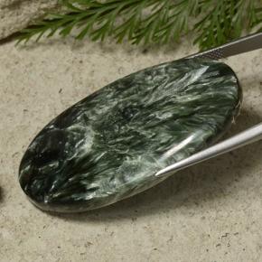 Serafinita verde natural 50,74ct, corte oval, opaco