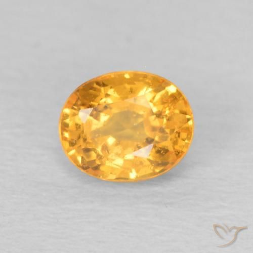 Granada espessartita Laranja escuro-dourado Natural 0.58ct, oval, VS