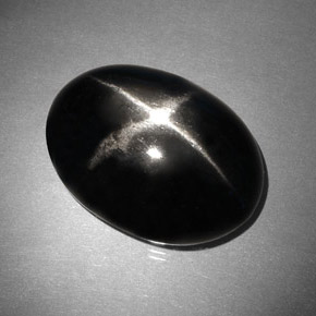 Diopsídio estrela preto natural 37,46ct, corte oval, opaco