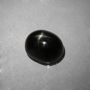 Diopsídio estrela preto natural 4,04ct, corte oval, opaco