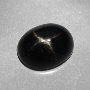 Diopsídio estrela preto natural 3,95ct, corte oval, opaco