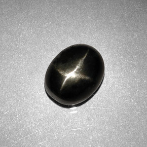 Diopsídio estrela preto natural 2,63ct, corte oval, opaco