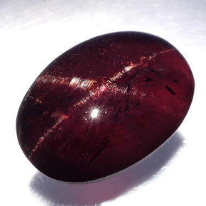 Granada estrela preto natural 19,80ct, corte oval, opaco