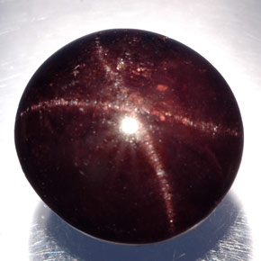 Granada estrela preto natural 21,50ct, corte oval, opaco
