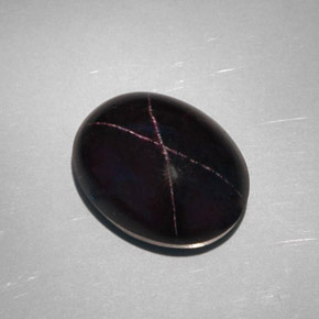 Granada estrela preto natural 28,81ct, corte oval, opaco