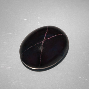 Granada estrela preto natural 28,81ct, corte oval, opaco