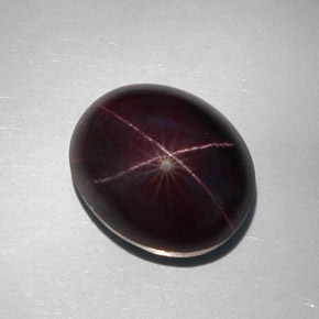 Granada estrela preto natural 34,12ct, corte oval, opaco