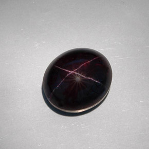 Granada estrela preto natural 32,55ct, corte oval, opaco