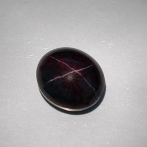 Granada estrela preto natural 32,55ct, corte oval, opaco