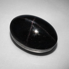 Granada estrela preto natural 31,96ct, corte oval, opaco