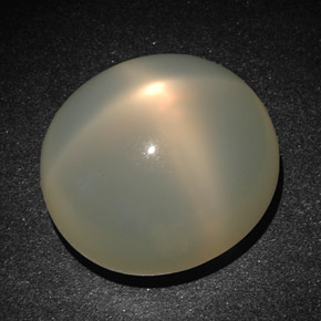 Pedra da lua estrela creme natural 22,83ct, corte oval, translúcido