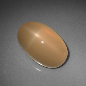 Pedra da lua estrela laranja natural 6,85ct, corte oval, translúcido