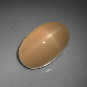 Pedra da lua estrela laranja natural 6,85ct, corte oval, translúcido