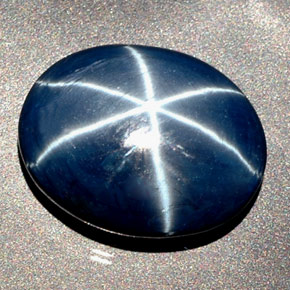 Safira estrela azul natural 27,48ct, corte oval, opaco