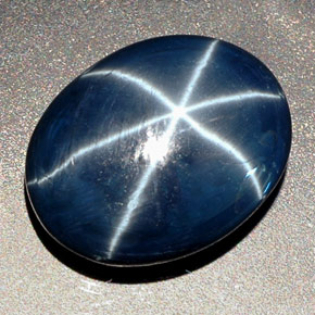 Safira estrela azul natural 27,48ct, corte oval, opaco