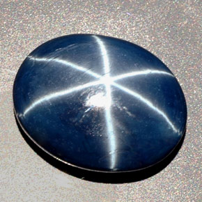 Safira estrela azul natural 27,48ct, corte oval, opaco