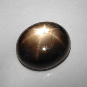 Safira estrela preto natural 22,73ct, corte oval, opaco