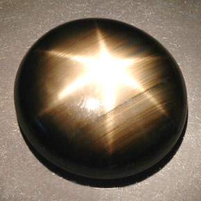 Safira estrela preto natural 55,93ct, corte oval, opaco