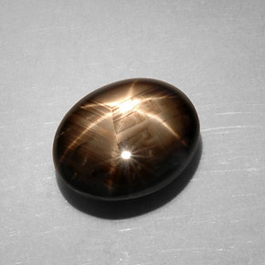 Safira estrela preto natural 7,59ct, corte oval, opaco