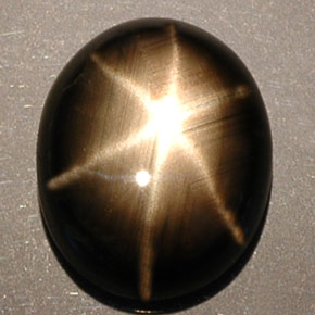 Safira estrela preto natural 5,25ct, corte oval, opaco