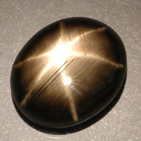 Safira estrela preto natural 5,25ct, corte oval, opaco