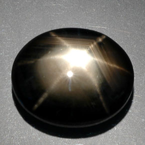 Safira estrela preto natural 9,39ct, corte oval, opaco