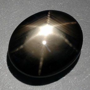 Safira estrela preto natural 9,39ct, corte oval, opaco
