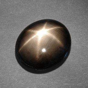 Safira estrela preto natural 13,78ct, corte oval, opaco