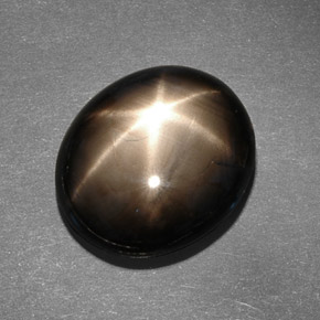 Safira estrela preto natural 13,78ct, corte oval, opaco