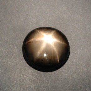 Safira estrela preto natural 12,04ct, corte oval, opaco