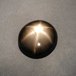 Safira estrela preto natural 12,04ct, corte oval, opaco