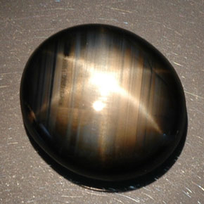 Safira estrela preto natural 16,89ct, corte oval, opaco