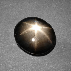 Safira estrela preto natural 9,26ct, corte oval, opaco