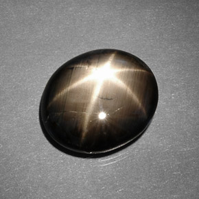 Safira estrela preto natural 9,26ct, corte oval, opaco