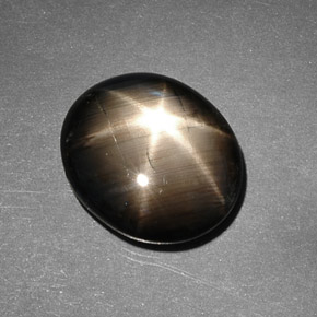 Safira estrela preto natural 9,26ct, corte oval, opaco