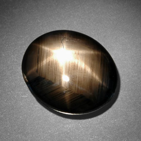 Safira estrela preto natural 10,78ct, corte oval, opaco