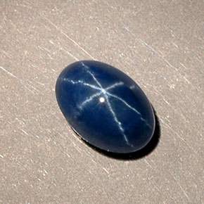 Safira estrela azul natural 1,15ct, corte oval, opaco