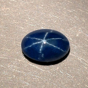 Safira estrela azul natural 1,15ct, corte oval, opaco