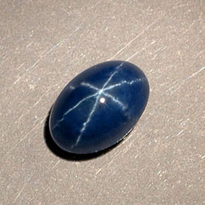 Safira estrela azul natural 1,15ct, corte oval, opaco