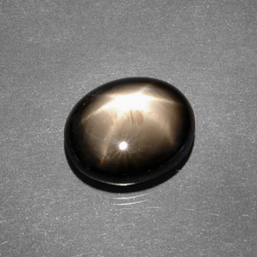 Safira estrela preto natural 7,88ct, corte oval, opaco