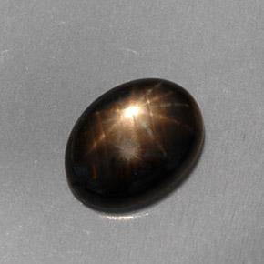 Safira estrela preto natural 1,59ct, corte oval, translúcido
