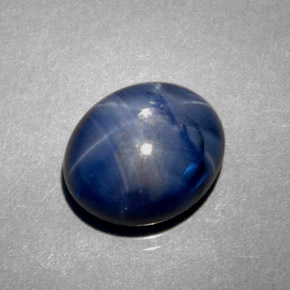 Safira estrela azul natural 5,38ct, corte oval, opaco