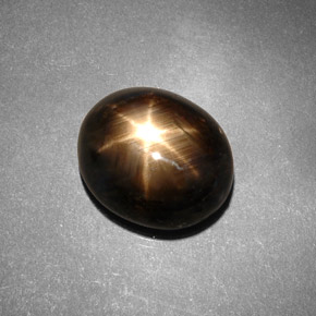 Safira estrela preto natural 7,46ct, corte oval, opaco