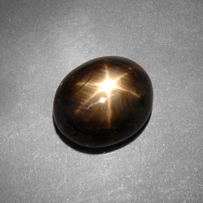 Safira estrela preto natural 7,46ct, corte oval, opaco