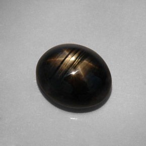 Safira estrela preto natural 10,73ct, corte oval, opaco