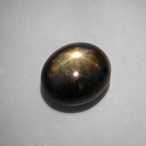 Safira estrela preto natural 12,34ct, corte oval, opaco