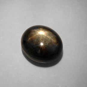 Safira estrela preto natural 12,34ct, corte oval, opaco