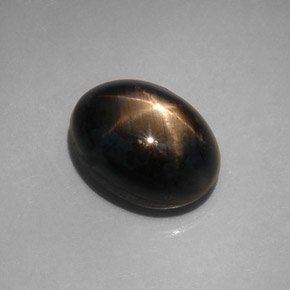 Safira estrela preto natural 12,08ct, corte oval, opaco