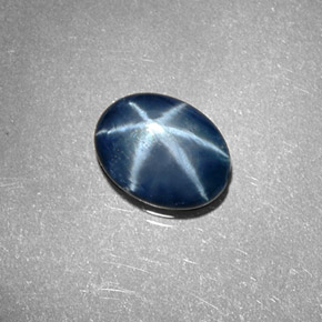 Safira estrela azul natural 1,30ct, corte oval, opaco